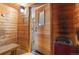 Relaxing home sauna with wooden walls, bench, heater, and glass door to the exercise room at 2154 Concord Ln, Superior, CO 80027