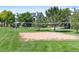 Outdoor sand volleyball court set amidst lush greenery, perfect for community fun and exercise at 2154 Concord Ln, Superior, CO 80027