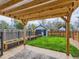 The backyard offers a pergola, garden, green lawn, and privacy fencing at 2849 S Bannock St, Englewood, CO 80110