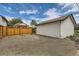 Spacious backyard area features a wooden fence, gravel and an outbuilding with alley access at 2849 S Bannock St, Englewood, CO 80110
