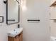 Modern bathroom featuring a unique floating sink, stylish mirror, and minimalist design at 2849 S Bannock St, Englewood, CO 80110