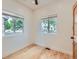Bright bedroom featuring hardwood floors, two windows, and neutral walls at 2849 S Bannock St, Englewood, CO 80110