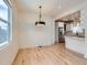 Bright dining area featuring hardwood floors and modern lighting at 2849 S Bannock St, Englewood, CO 80110