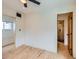 An airy room featuring hardwood floors, neutral walls, and doorway view into another room at 2849 S Bannock St, Englewood, CO 80110