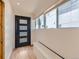 Welcoming entryway features a modern door, large windows, and comfortable bench seating at 2849 S Bannock St, Englewood, CO 80110