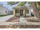 Charming renovated exterior with new siding, front door, landscaping, and sidewalk at 2849 S Bannock St, Englewood, CO 80110