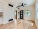 Open-concept living area with built-in shelves, modern appliances, and an unusual decorative ladder to the roof at 2849 S Bannock St, Englewood, CO 80110