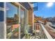 Private balcony with sliding glass doors and chair at 1488 Madison St # 310, Denver, CO 80206