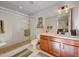 Clean bathroom with a walk-in shower and wood cabinets at 1488 Madison St # 310, Denver, CO 80206