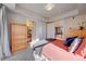 Cozy bedroom with built-in shelving and access to a bathroom at 1488 Madison St # 310, Denver, CO 80206