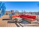 Relaxing rooftop deck with sectional sofa and chairs at 1488 Madison St # 310, Denver, CO 80206