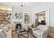 Bright living room with a fireplace, built-in shelves, and large windows at 2135 N Gilpin St, Denver, CO 80205