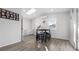 Cozy dining area with a skylight, modern furniture, and stylish wood floors, perfect for Gathering meals at 555 Everett St, Lakewood, CO 80226