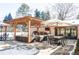 Outdoor patio with pergola, seating, and dining area at 3330 S Columbine Cir, Englewood, CO 80113