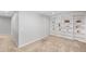 Bright finished basement with neutral carpet and paint, featuring custom built-in shelves at 3529 Huron Peak Ave, Superior, CO 80027
