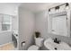 Bathroom with a modern sink, toilet with small plant, decorative lighting and washer and dryer in the same space at 3529 Huron Peak Ave, Superior, CO 80027