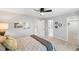Bright bedroom featuring carpet flooring, ceiling fan, neutral walls, and multiple doors leading to other rooms at 3529 Huron Peak Ave, Superior, CO 80027