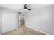 Carpeted bedroom featuring a ceiling fan, closet with double doors and door leading to the hallway at 3529 Huron Peak Ave, Superior, CO 80027