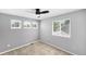 Bright bedroom with three large windows and neutral walls and carpet at 3529 Huron Peak Ave, Superior, CO 80027