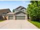Attractive two-story home boasts a three-car garage, brick accents, and a well-maintained front lawn at 3529 Huron Peak Ave, Superior, CO 80027