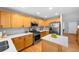 Bright kitchen features stainless appliances, light countertops, herringbone backsplash, and ample wood cabinetry at 3529 Huron Peak Ave, Superior, CO 80027