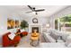 Cozy living room provides a fireplace, plush seating, and a ceiling fan for added comfort and style at 3529 Huron Peak Ave, Superior, CO 80027