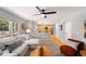 Open-concept living space connects to kitchen with neutral decor, plush seating, and sliding door access at 3529 Huron Peak Ave, Superior, CO 80027