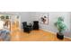Comfortable sitting area with hardwood floors, stylish chairs, and artwork offers a cozy place to relax at 3529 Huron Peak Ave, Superior, CO 80027