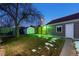 Landscaped backyard with shed and outdoor lighting at 1190 Elmira St, Aurora, CO 80010