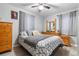 Well-lit bedroom with a double bed and wooden dresser at 1190 Elmira St, Aurora, CO 80010