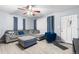 Bright living room with grey sectional sofa and hardwood-style flooring at 1190 Elmira St, Aurora, CO 80010