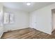 Spacious bedroom with hardwood floors and neutral walls at 1716 Akron St, Aurora, CO 80010