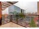 City views abound from this condo's outdoor balcony with sleek metal railings and covered ceiling at 191 Clayton Ln # 402, Denver, CO 80206