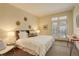 Bright bedroom with large bed, french doors, and tasteful decor throughout at 191 Clayton Ln # 402, Denver, CO 80206
