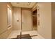 A modern lobby area features an elevator, neutral walls, tile flooring and sleek fixtures for a professional setting at 191 Clayton Ln # 402, Denver, CO 80206