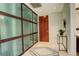 Stylish condo entryway with tile floor, closet and decorative accents at 191 Clayton Ln # 402, Denver, CO 80206