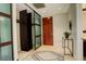 Stylish condo entryway with tile floor, closet and decorative accents at 191 Clayton Ln # 402, Denver, CO 80206