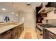 Modern kitchen with stainless steel appliances, light countertops, and dark wood cabinets at 191 Clayton Ln # 402, Denver, CO 80206
