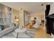 Spacious living area seamlessly connects with the dining area and kitchen at 191 Clayton Ln # 402, Denver, CO 80206