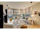 Comfortable living room with modern decor, large windows, and ample natural light at 191 Clayton Ln # 402, Denver, CO 80206