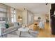 Open living room showcasing modern decor, hardwood floors, and views of the cityscape at 191 Clayton Ln # 402, Denver, CO 80206