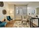 Bright office space with natural light, stylish decor, and a functional glass-top desk for productivity at 191 Clayton Ln # 402, Denver, CO 80206