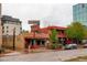 This is a street view of Duffy's Cherry Cricket restaurant, showcasing its exterior signage, brick facade, and urban setting at 191 Clayton Ln # 402, Denver, CO 80206