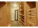 Custom walk-in closet with ample storage and space for organization and easy outfit selection at 191 Clayton Ln # 402, Denver, CO 80206