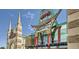 Unique movie theater design featuring colorful architectural elements, a distinctive spire, and eye-catching signage at 7743 S Cherokee Trl, Centennial, CO 80016