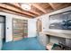 Finished basement with exposed beam ceiling, window, and vintage decor at 7105 Flagstaff Rd, Boulder, CO 80302