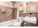 Functional bathroom with tile surround in shower-tub, vintage medicine cabinet, and standard fixtures at 7105 Flagstaff Rd, Boulder, CO 80302