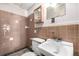 Retro bathroom with brown tile, vintage sink and toilet at 7105 Flagstaff Rd, Boulder, CO 80302