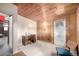 Versatile bedroom with wood-paneled walls and a functional desk setup, ideal for a home office at 7105 Flagstaff Rd, Boulder, CO 80302