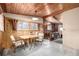 The dining room features a table with two chairs and bright natural light from the windows at 7105 Flagstaff Rd, Boulder, CO 80302